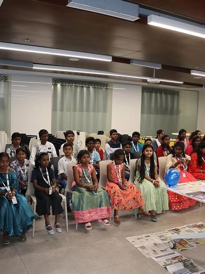 The bright, eager faces of the children from Sneha Shraya Foundation, ready to start their cap painting adventure.