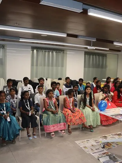 The bright, eager faces of the children from Sneha Shraya Foundation, ready to start their cap painting adventure.