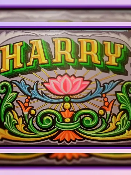 A slightly different version of the "Harry" nameplate, showing the detail in the lettering and lotus design.