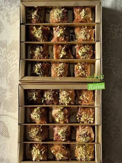 This is an order of my signature Baklava. I fill the layers with a mix of pistachios and almonds and then soak it in a warm jaggery and honey syrup.