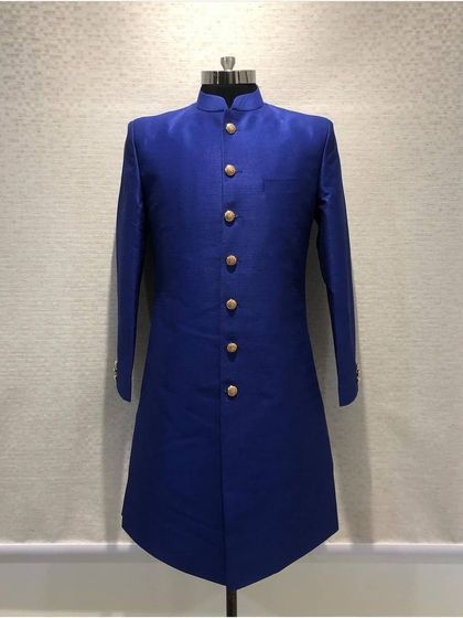 A vibrant royal blue silk sherwani. The simplicity of the design is elevated by the rich color, fine fabric, and my precise tailoring.