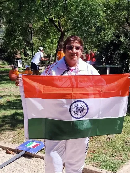 Our director proudly holding the Indian flag in Portugal. This level of experience and passion is what we bring to our coaching every single day.