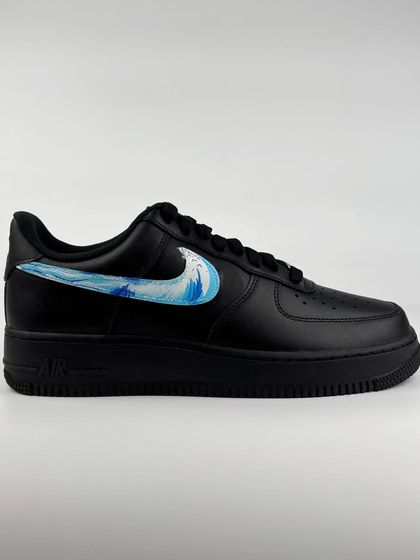 The other shoe in the pair, featuring a water wave swoosh.