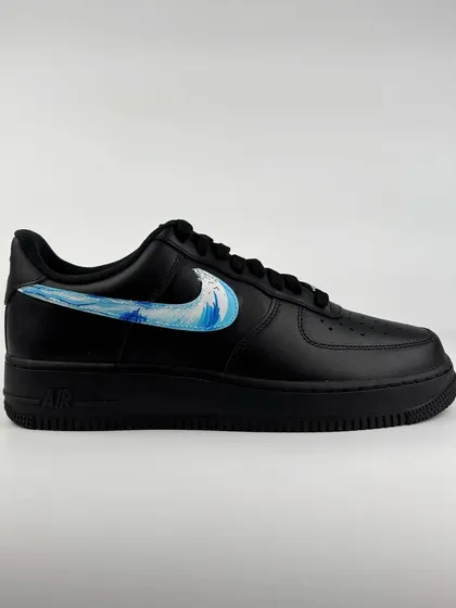 The other shoe in the pair, featuring a water wave swoosh.