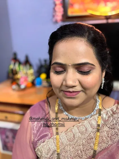 An example of my soft nude party makeup. This look focuses on enhancing features with subtle eyeshadow, a clean base, and a soft lip color, perfect for any celebration.