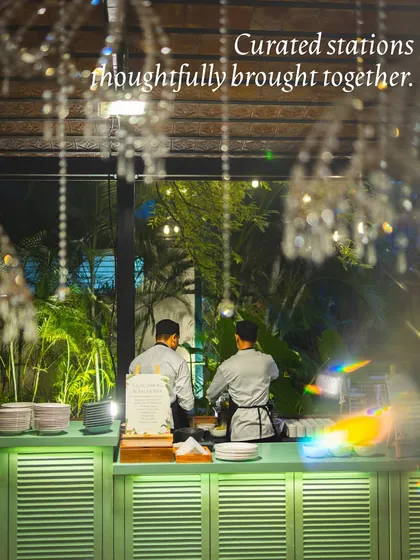 A view of our chefs at a live station, working together to bring curated dishes to life.