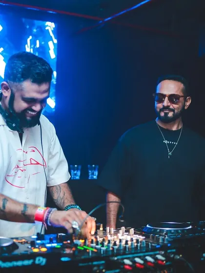 All smiles during a high-energy B2B performance. This photo captures the fun and synergy of playing alongside another artist, creating a memorable night for everyone.