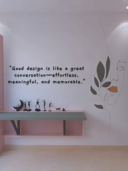 A conceptual image with a design quote, showcasing a minimalist desk area with artistic wall decor.