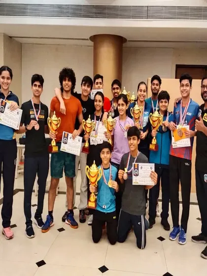 Our players celebrating their victories at the TSTTA District Championship. We believe in creating a supportive team environment where every player's success is celebrated.