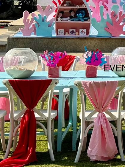 Another view of the kids' tables, showing the coral props and fishbowl centerpieces.