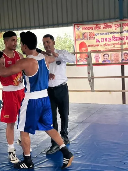 Showing respect to his opponent after the final bell. This is the mark of a true sportsman.