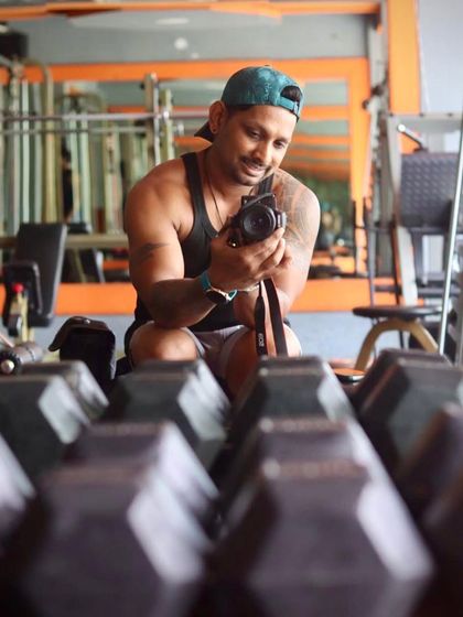 Taking a moment to check the camera during a gym photoshoot. It's fun to capture the process.