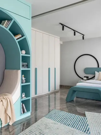 This kids' bedroom is a perfect blend of playfulness and practicality. The room features a cozy reading nook, ample storage, and a soothing color palette, all thoughtfully chosen to create a space that delights both parents and children.