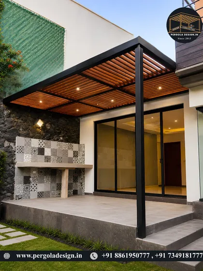 A beautiful patio cover with a wood-slat ceiling and integrated lighting. This structure extends the living space outdoors, creating a perfect spot for a barbecue or outdoor lounge area.