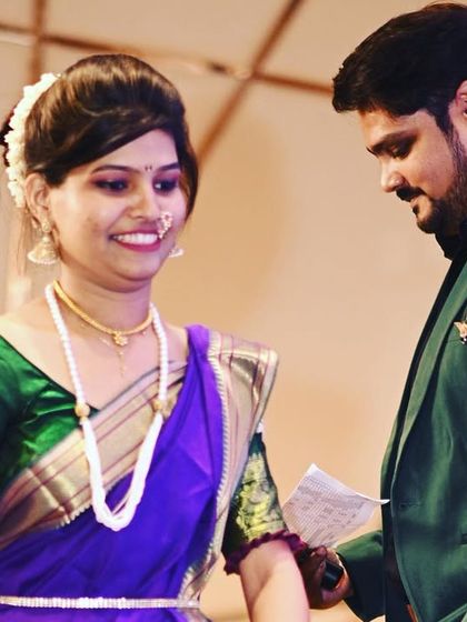 Interacting with a traditionally dressed guest on stage. I am adept at hosting for diverse audiences, showing respect for culture while keeping the vibe fun and modern.