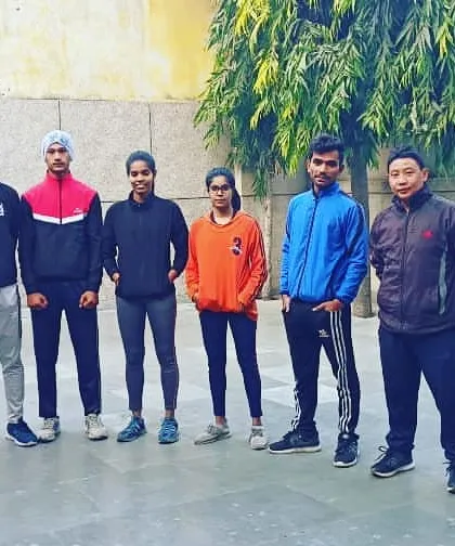 This is my team, my family. We are a group of dedicated individuals, both men and women, united by the goal of self-improvement through the discipline of karate. We train together, we grow together.