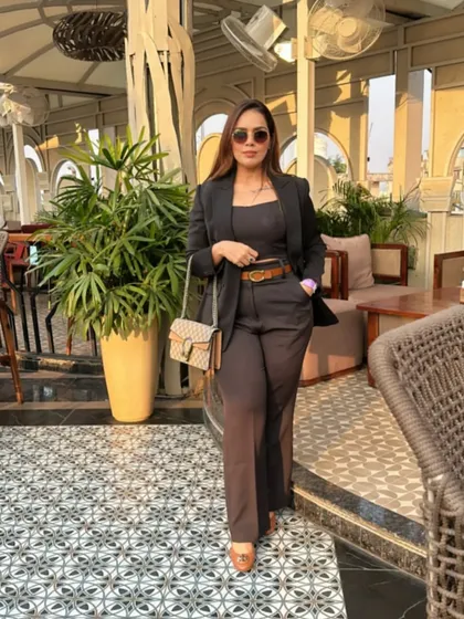 A well-fitted blazer is a cornerstone of any power wardrobe. Here, I've styled a dark co-ord set with a structured blazer, creating a look that is both professional and incredibly chic for any corporate setting.