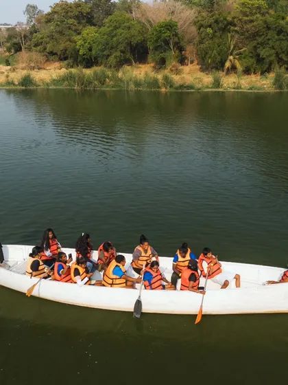 A large group enjoys a ride in our big canoe, with one of my adventure team members guiding them safely.