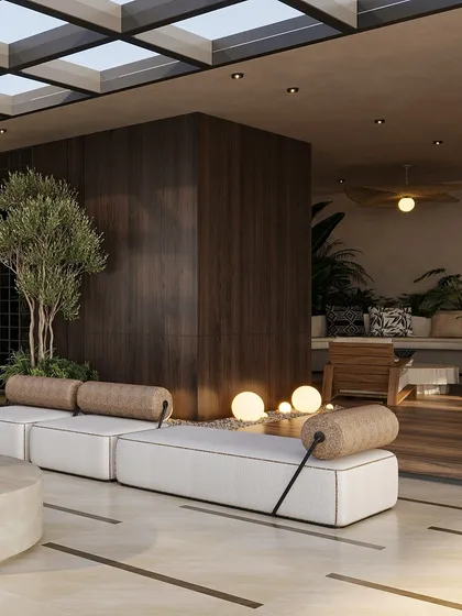 Lush greenery and warm, spherical floor lamps are integrated into the terrace design, softening the architecture and creating a magical ambiance at dusk. The dark wood paneling adds a sense of warmth and enclosure.