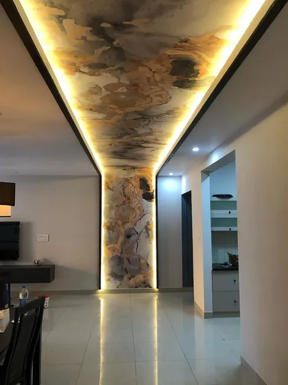 The final look of the completed ceiling and pillar project, demonstrating a perfect, high-end installation that completely transforms the room's ambiance.