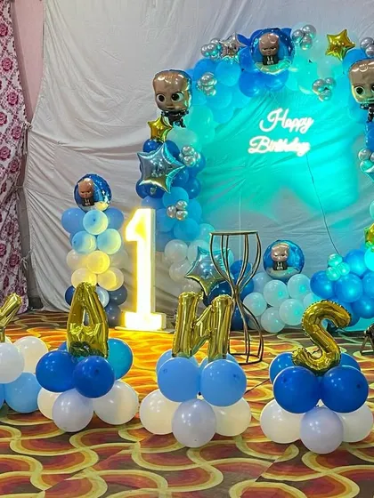 Another view of the Boss Baby setup, showing the character foil balloons integrated into the ring.