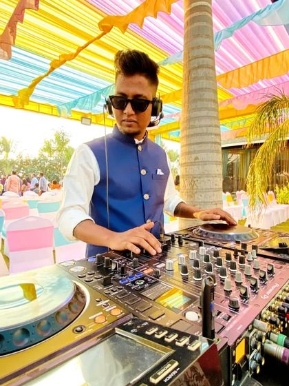 A sharp, professional portrait of me at the decks during a Sangeet in Surat.