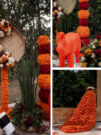Details from the marigold backdrop, including the scrap-fabric elephant and the colorful floral arrangements. The combination of textures and bright colors created a festive and joyful atmosphere.