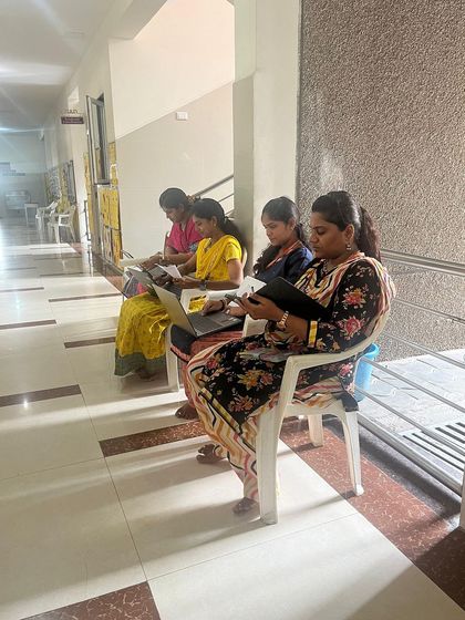 Teachers from Senthil Public School preparing for their online review, showcasing our blended support model.