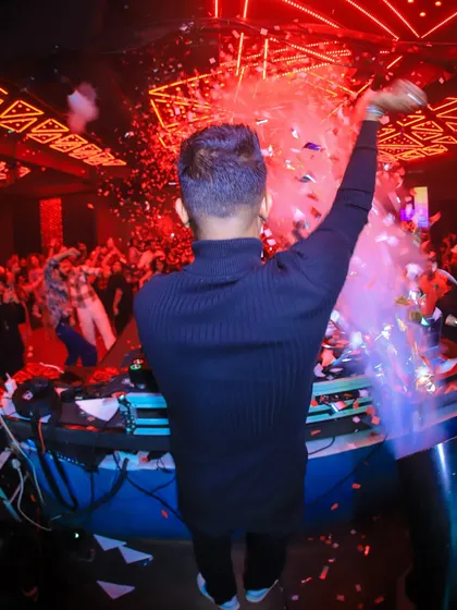 A view from behind, as I orchestrate a confetti drop at Club Illusions. It's all about creating those picture-perfect moments.