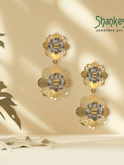 A touch of antiquity in every gleaming piece. These modern, floral-inspired earrings feature a two-toned finish, offering a contemporary and stylish option for your customers.