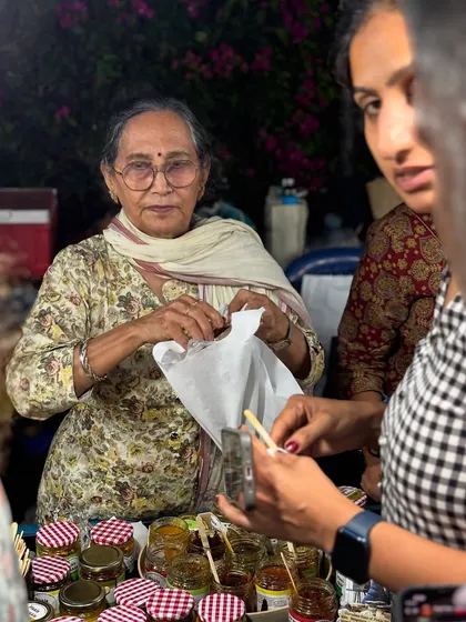 Packing an order for a customer at our stall. It's a simple, happy moment that makes all the hard work worthwhile.