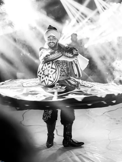A powerful black and white shot of a Tanoura dancer in mid-spin. These artists bring a different kind of energy and artistry to an event.