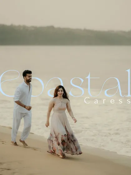 A serene portrait of the couple walking along the shoreline at dusk. The soft light and gentle waves create a peaceful and romantic atmosphere for this Goa beach photoshoot.