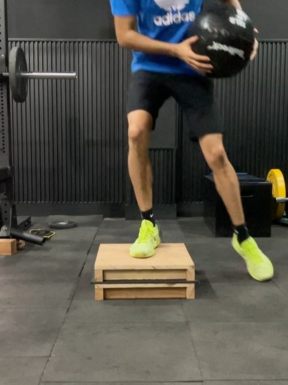A low-intensity plyometric drill using a box and a medicine ball. This helps build foundational work capacity and coordination, preparing the athlete for more demanding exercises.