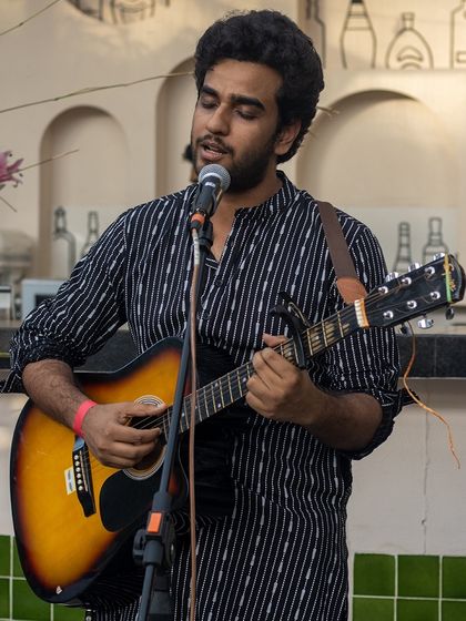 A talented guitarist and singer during our open mic segment. We provide the platform for artists to shine.