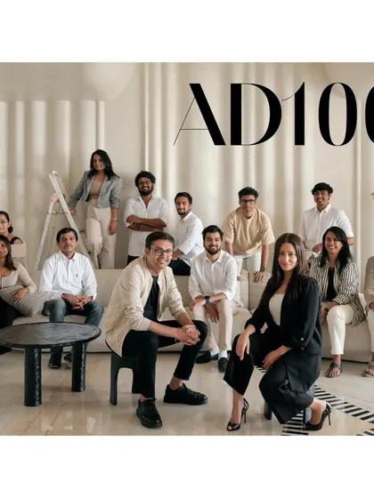 A group portrait of our talented team, celebrating our inclusion in the prestigious AD100 list. Our collaborative spirit and shared passion for design are the driving forces behind every project we undertake.