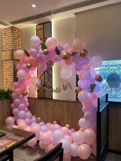 Another angle of the pastel balloon arch, showing how it creates a perfect frame for a photo booth or entrance.
