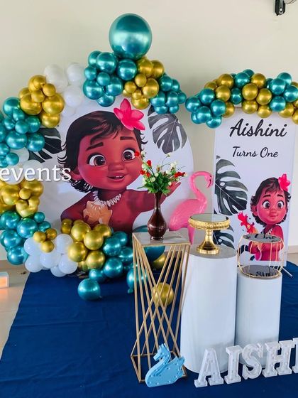 Another Moana-themed setup with a large character backdrop and marquee number.