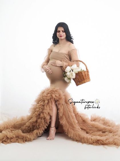 A high-key studio shot with the ruffled gown, creating a bright and airy feel while still keeping the boho textures.