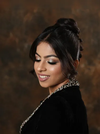 A smiling shot that brings the makeup to life. This image shows how a glamorous look can still feel fresh and joyful, an important aspect of client work.