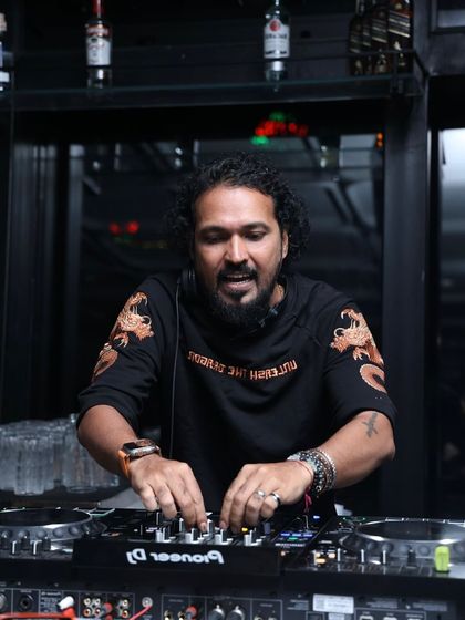 In my element during a New Year's Eve set in Thane. I am focused on the mix, lining up the perfect track to welcome the new year with a bang.