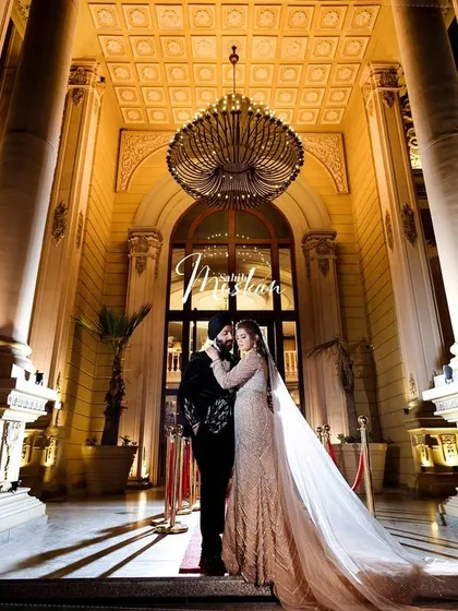 A portrait of modern royalty. We framed Sahib and Muskan against the magnificent architecture, using dramatic lighting to create a sense of grandeur and timelessness. This is how we turn wedding portraits into cinematic art.