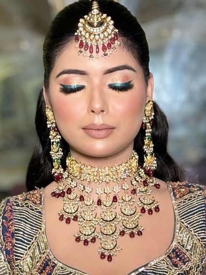 Another shot of the blue eyeshadow, showing how it catches the light and adds a modern twist to a traditional outfit.