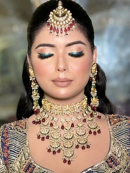 Another shot of the blue eyeshadow, showing how it catches the light and adds a modern twist to a traditional outfit.