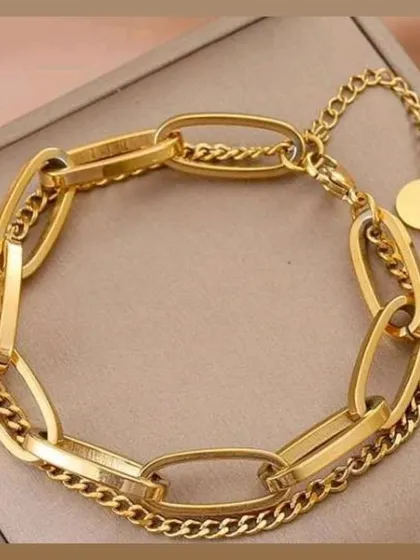 This stylish double-chain link bracelet is a modern and chic accessory. Made from durable stainless steel, it combines two different chain styles for a unique, layered look that is perfect for any outfit.