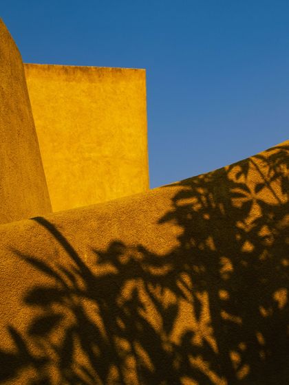 The play of shadows on the curved walls creates a dynamic visual that changes with the light.