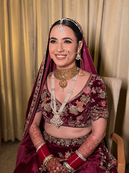 My beautiful Kashmiri bride Arushi. We created a soft, glowing look to complement her traditional velvet lehenga, focusing on radiant skin and defined eyes.