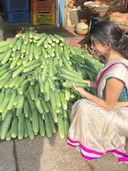 Local markets always open my heart. Here I am at the Devaraja Market in Mysore, admiring a huge pile of fresh cucumbers, a staple in a healthy, hydrating diet.