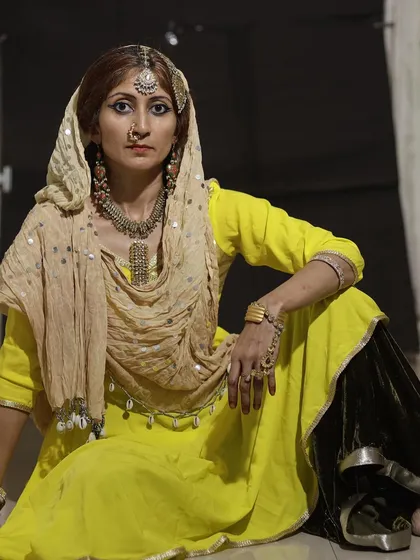 In costume for a performance, embodying a character from another time. The details of costume and makeup are a gateway for me to step into a different world and tell a new story.