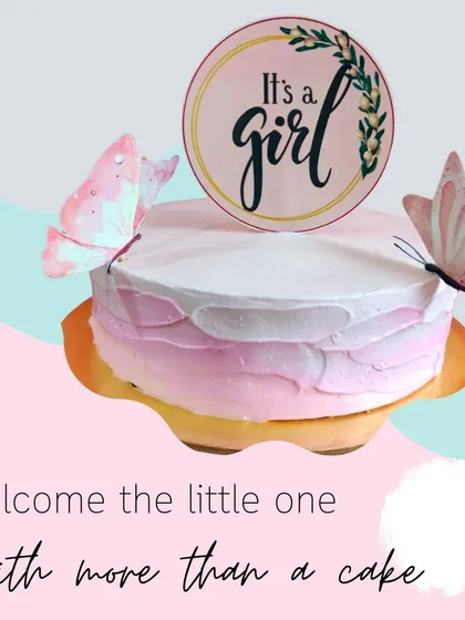 Welcome a little one with this sweet "It's a girl" cake. The gentle pink ombre design, adorned with delicate butterflies, is a perfect centerpiece for a baby shower or to celebrate a newborn's arrival.